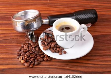 Cinnamon sticks, coffee beans and powder on white background