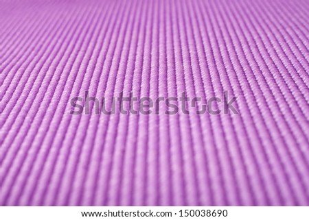 Close up shot of a purple yoga mat