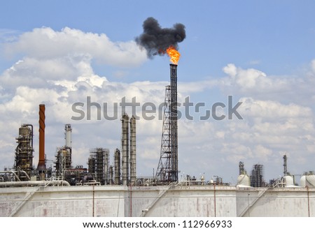 Fire and smoke from an oil refinery pipe in Rotterdam industrial area in Holland