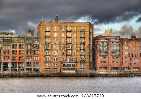 Historical warehouse converted into luxury apartments on the Thames in London, UK