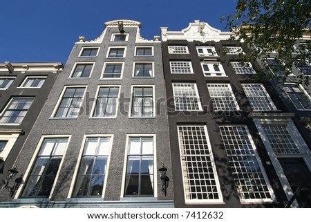 Historical mansions in Amsterdam with multiple pane windows