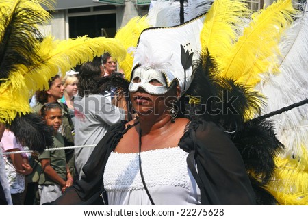 Masked lady carnival dancer in the parade at the Caribbean Carnival in Rotterdam.
