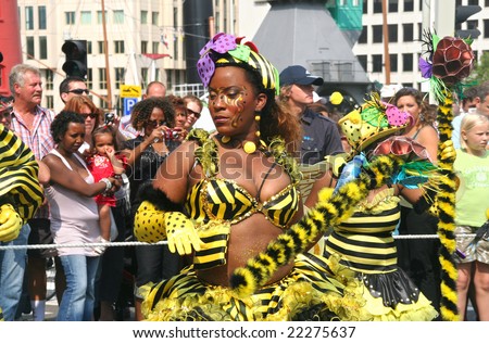 Beautiful black carnival dancer with Bee theme at the Caribbean carnival parade in Rotterdam on July 26.