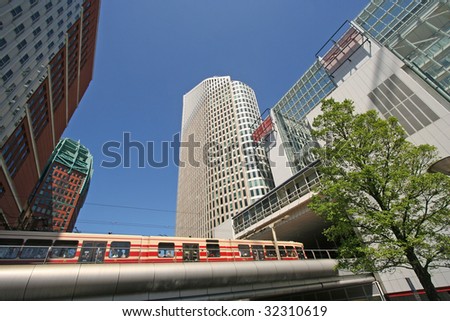 Tram among modern architecture of The Hague