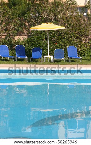 Swimming pool and pool chairs
