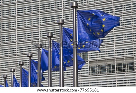 European Union flags in front of the Berlaymont building in Brussels, Belgium
