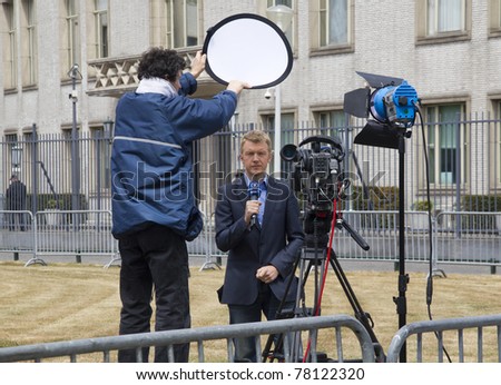 THE HAGUE, HOLLAND - MAY 27: Reporter of German television WDR 1at the trial for war crimes of Serbian ex-general Mladic at the Yugoslavia Tribunal in The Hague, Holland on May 27, 2011