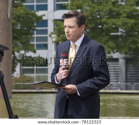 THE HAGUE, HOLLAND - MAY 27: Reporter of French television station France 2 at the trial for war crimes of Serbian ex-general Mladic at the Yugoslavia Tribunal in The Hague, Holland on May 27, 2011