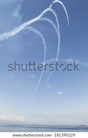 Russian military airplanes are drawing image in blue sky