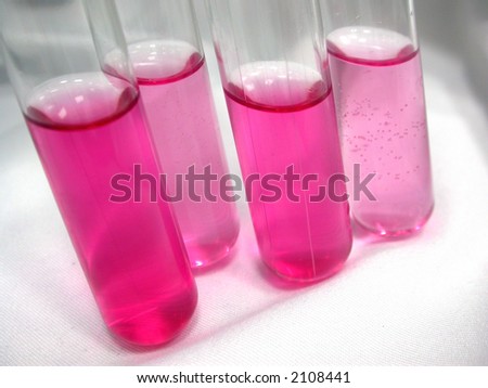 tubes with pink solutions in a biochemistry lab