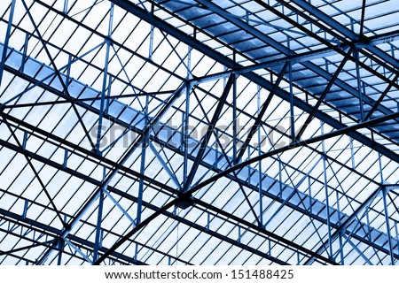 Glass roof of industrial building, toned in blue