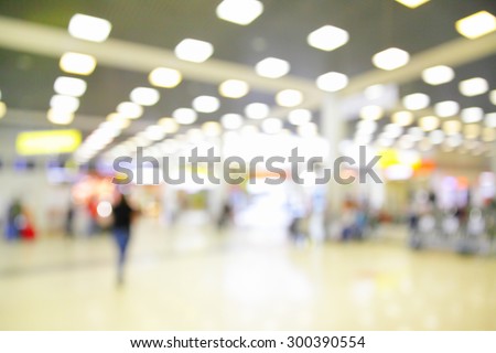 Hall with duty free shops in airport out of focus - defocused blurred background
