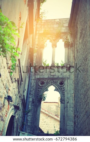 Ancient ruins in Old town of Kotor, Montenegro. Retro style filtered image