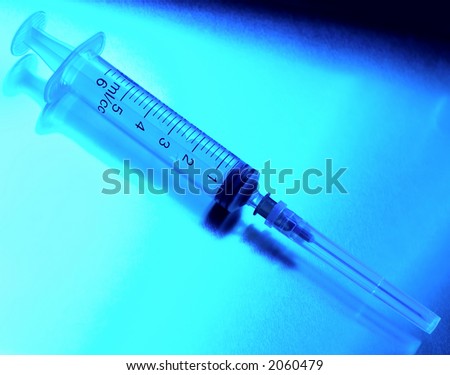 Syringe close-up toning in blue