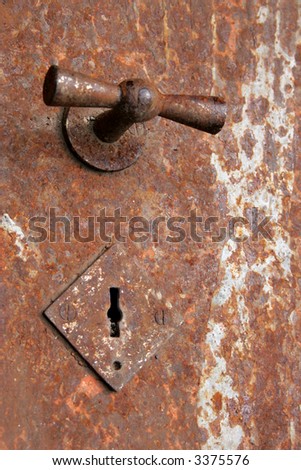 Door of old rusty safe close-up
