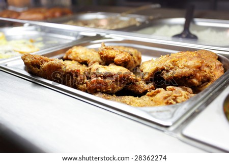 Hot tray with roasted meat close-up in dining room