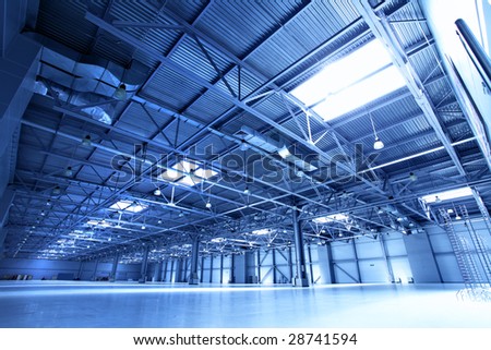 stock-photo-empty-warehouse-toned-in-the-blue-color-28741594.jpg