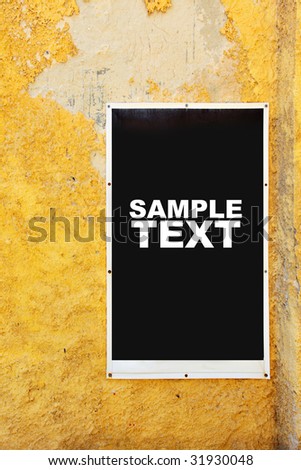 Poster on yellow shabby wall. Put your own text or image here