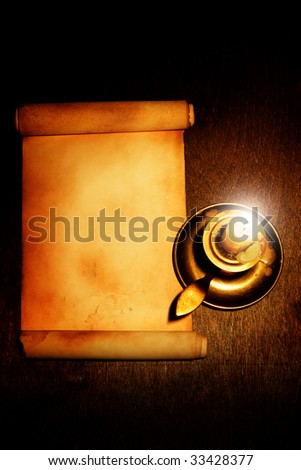 Old scroll and candle on wooden table