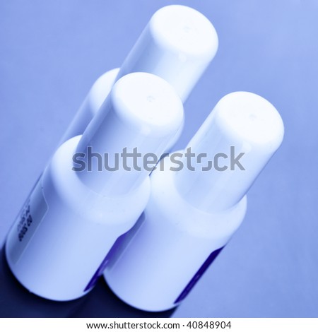 Three spray cans with drugs close up