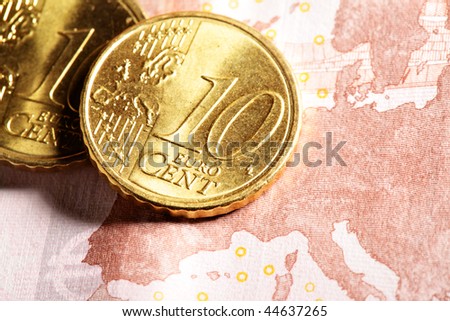 Euro zone - Ten euro cent coins close up on bank note