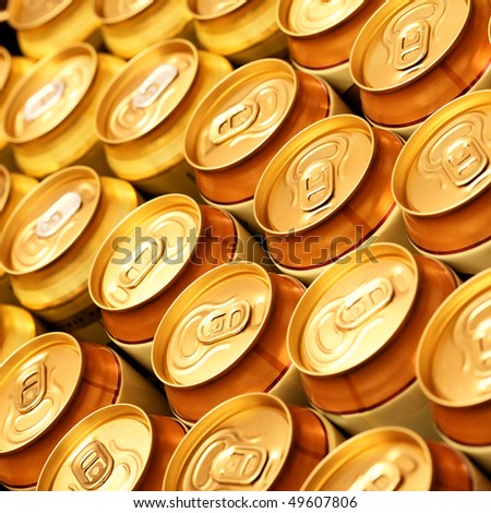 Much of gold beer cans close up