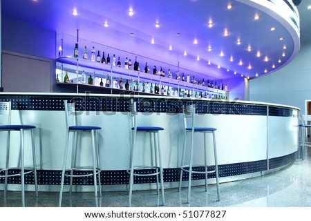 Bar interior with round couter and stools