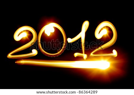 Happy new year 2012 message over black background