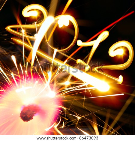 stock-photo-new-year-and-sparkler-on-fire-86473093.jpg