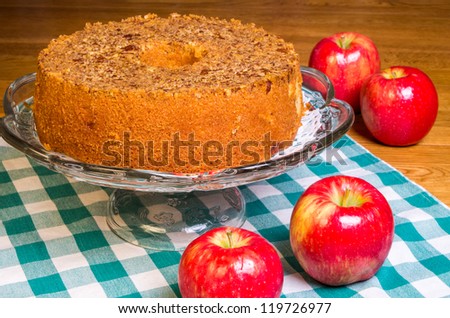 Red apples and fresh apple cake on display