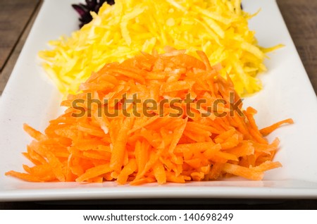 Freshly shaved carrots in three colors ingredients for carrot cake
