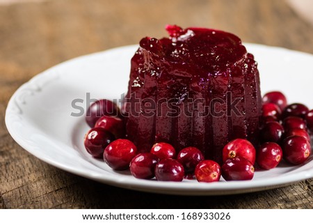 Homemade cranberry sauce with whole cranberries on white plate