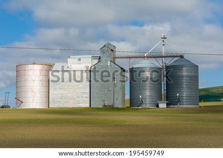 Group of grain storage buildings and silos in a rural area