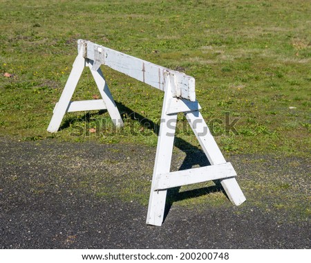 A saw horse or wooden barrier to control traffic