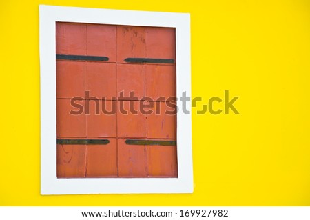 brown wood frame on yellow background