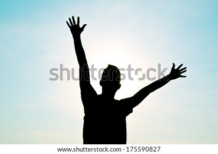 silhouette of man jumping for happy and victory