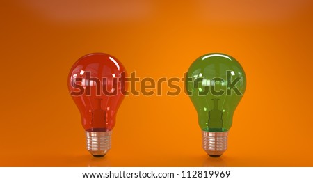 Green and red light bulbs on orange backgroud