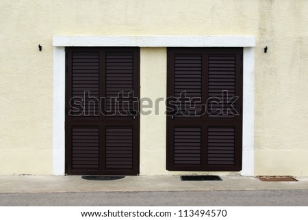Brown door with shutters in front view, Croatia