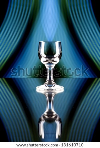 Glass of alcohol on disco background, party atmosphere