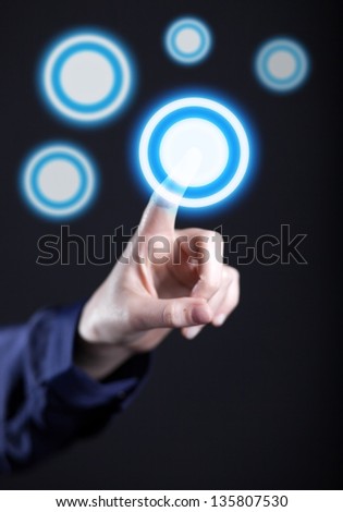 Woman\'s hand pushing the button on touch screen. Choice concept