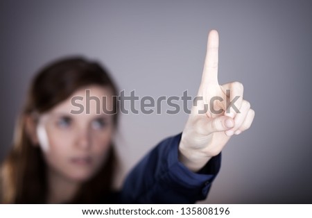 Woman's hand and one finger pointing something