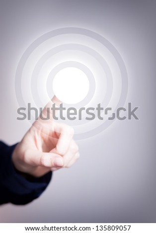 Woman\'s hand pushing the button on touch screen