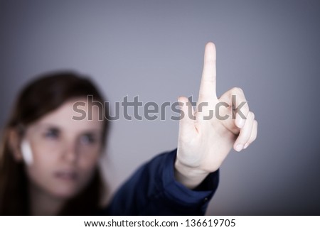 Woman\'s hand and one finger pointing something
