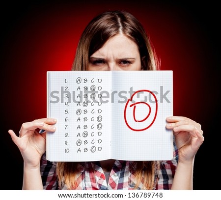School grade of exam and disappointed woman