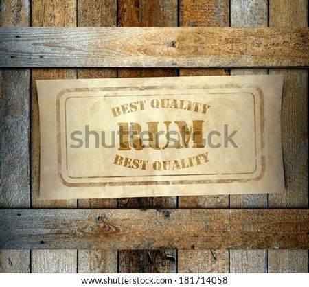 Stamp Best Quality Rum label on old wooden box