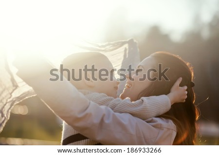 Mother and child playing in the park outdoor