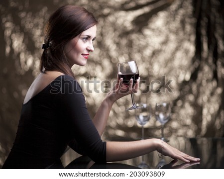 Glamour woman sitting alone in luxury restaurant