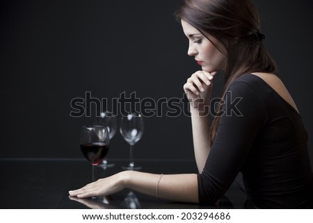 Lonely unhappy woman in restaurant waiting for date