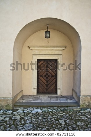 Old entrance with lamp in castle