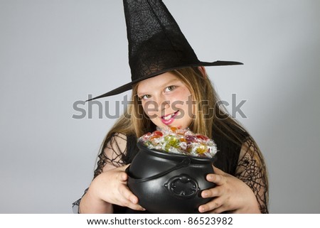 Witch Holding Cauldron filled with lollies
